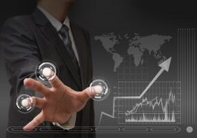 Businessman standing and working wth touch screen technology