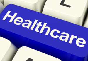 Healthcare Key In Blue Showing Online Health Care