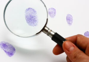Police Examine A Fingerprint Left By A Suspect