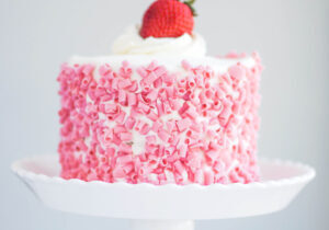 Strawberry Cake With White Cream On Wooden Background
