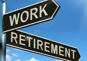 Work Or Retire Signpost Showing Choice Of Working Or Retirement